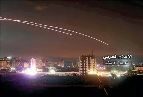  ?? AP ?? Israeli missiles hit air defence positions and other military bases in Damascus, Syria.