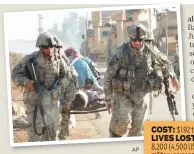  ?? AP ?? US soldiers carry an injured Iraqi civilian, following a roadside blast near Baghdad in 2008.