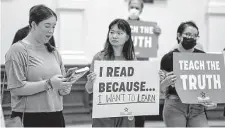  ?? Rodolfo Gonzalez/Contributo­r ?? Shayna Levy, left, an Austin ISD high school student, speaks during the Texas Freedom Network read-in demonstrat­ion held in July in Austin.