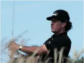  ?? PETER MUHLY/AFP/GETTY IMAGES ?? U.S. golfer Phil Mickelson, shown on the seventh tee at Muirfield on Monday, won the Scottish Open.