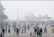  ?? DEEPAK SANSTA / HT ?? Tourist rush on The Ridge as the weather turned cloudy in Shimla on Sunday.