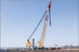  ?? AP photo ?? The Chesapeake 1000 crane, which will be used to help remove wreckage from the collapse of the Key Bridge, is docked at Tradepoint Atlantic in Sparrows Point, Md., on Friday.