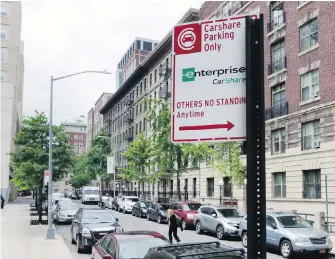  ?? RICHARD DREW, THE ASSOCIATED PRESS ?? A sign marks an area on New York’s Upper West Side as car-share parking only. New Yorkers are at odds over a new program that is repurposin­g parking spots to companies that rent out cars by the hour.