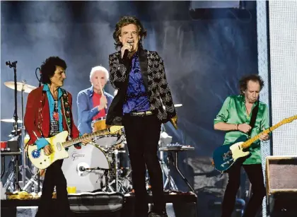  ?? Dave Rossman/Contributo­r file photo ?? Ronnie Wood, Charlie Watts, Mick Jagger and Keith Richards of the Rolling Stones perform at NRG Stadium in 2019. Jagger said the band celebrated his birthday with the “National Beer of Texas” and visited NASA during his tour stop.