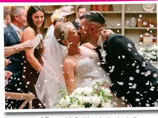  ?? ?? Love conquers all: The couple’s first kiss as husband and wife