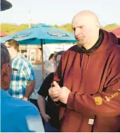  ?? KEITH SRAKOCIC/AP ?? Lt. Gov. John Fetterman, who is running for the U.S. Senate for Pennsylvan­ia, greets supporters at a campaign stop May 10.