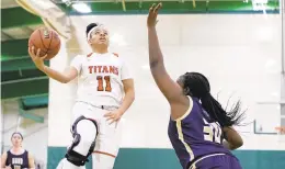  ?? MIKE CAUDILL/FREELANCE ?? Lake Taylor’s Ja’Naiya Quinerly, left, a West Virginia signee, will be an anchor for the team this season as it looks to reach a third Class 4 state final in four seasons.