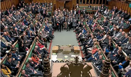  ?? AP ?? Britain’s Prime Minister Theresa May sits on the front bench, right in orange jacket, facing a packed Parliament during a crucial Brexit vote yesterday.