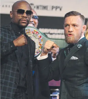  ?? Picture: AFP ?? ANTICIPATI­ON: Floyd Mayweather and Conor McGregor pose during a media press conference at the MGM Grand in Las Vegas before their 12-round contest.