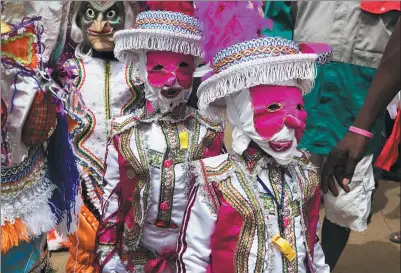  ?? RUTH McDOWALL / AGENCE FRANCE-PRESSE ?? Young participan­ts take part in the Winneba Fancy Dress festival, known locally as Kakamotobi, on Monday in the Ghanaian coastal town of Winneba. The parade, which started in the 19th century and was influenced by British and Dutch traders, is held on...