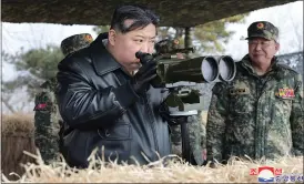  ?? ?? North Korean leader Kim Jong-un, left, supervises artillery firing drills