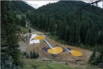  ?? THE ASSOCIATED PRESS ?? Mine wastewater flows through a series of retention ponds built to contain and filter out heavy metals and chemicals from the Gold King Mine chemical accident in the spillway about a quarter-mile downstream from the mine, outside Silverton, Colo., on...