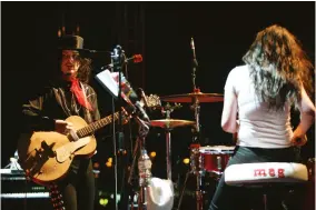  ?? ?? ABOVE: With his 1950s Kay Hollowbody at a White Stripes show, with drummer Meg White, October 1, 2005