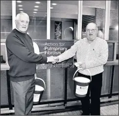  ??  ?? ■ Cheque presentati­on by John Gibson of Loughborou­gh Male Voice Choir (left) to Alan Tratt, chair of the Leicesters­hire Pulmonary Fibrosis Support Group.