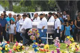  ?? JAE C. HONG AP ?? Pallbearer­s carry the casket of Amerie Jo Garza to her burial site in Uvalde, Texas. Hundreds of people turned out to pay their respects.