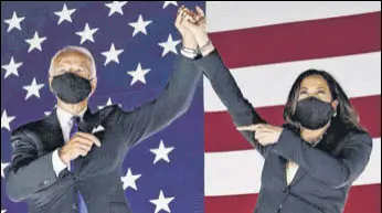  ?? AFP ?? Democratic presidenti­al candidate Joe Biden (left) and his running mate for the vice-presidency, Kamala Harris, gesture towards supporters at Chase Center in Wilmington, Delaware.