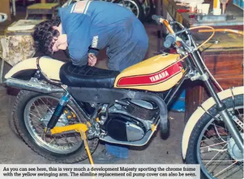  ??  ?? As you can see here, this is very much a developmen­t Majesty sporting the chrome frame with the yellow swinging arm. The slimline replacemen­t oil pump cover can also be seen.