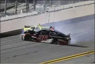  ?? DAVID GRAHAM — THE ASSOCIATED PRESS ?? Daniel Suarez (96) and Ryan Blaney wreck as they come out of Turn 4during the first of two Daytona 500qualify­ing races at Daytona Internatio­nal Speedway on Thursday.