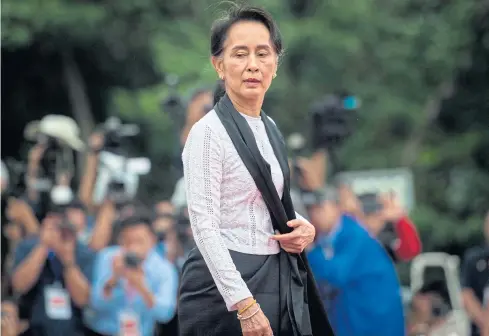  ?? AFP ?? Myanmar State Counsellor Aung San Suu Kyi arrives to pay her respects to her late father during a ceremony marking the 71st anniversar­y of Martyrs’ Day in Yangon last month.