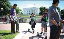  ?? SARAH L. VOISIN / WASHINGTON POST ?? Tourists and locals enjoy the sunny weather May 10 at Lafayette Square, a public park just north of the White House, in Washington.