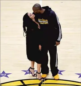  ?? Mark Terrill Associated Press ?? KOBE BRYANT kisses his wife Vanessa after scoring 60 points for the Lakers against the Utah Jazz in his final game, April 13, 2016, after a 20-year career.