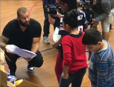  ?? Photo by Brendan McGair ?? Patriots defensive end Lawrence Guy spoke to children at Providence’s Spaziano Elementary School Tuesday morning about the importance of education.