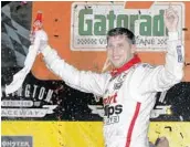  ?? TERRY RENNA/ASSOCIATED PRESS ?? Driver Denny Hamlin celebrates in Victory Lane after winning the Cup Series race at Darlington last September.