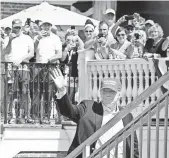  ?? KELVIN KUO, USA TODAY SPORTS ?? President Donald Trump waves to the crowd Sunday during the final round of the U.S. Women’s Open golf tournament at Trump National Golf Club-New Jersey.