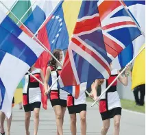  ?? JEWEL SAMAD/AFP/GETTY IMAGES ?? F1 has left itself open to criticism for employing curvy “grid girls” to do little more than stand there and look pretty, as they did last year.