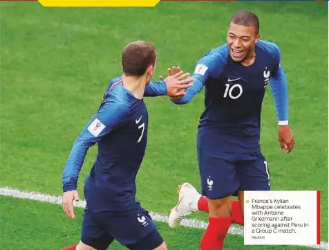  ?? Reuters ?? France’s Kylian Mbappe celebrates with Antoine Griezmann after scoring against Peru in a Group C match.