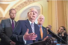  ?? SCOTT J. APPLEWHITE/ASSOCIATED PRESS ?? Senate Majority Leader Mitch McConnell, R-Ky., flanked by Sen. John Thune, R-S.D., left, and Majority Whip John Cornyn, R-Texas, speaks Tuesday following weekly policy meetings at the Capitol.