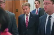  ?? PABLO MARTINEZ MONSIVAIS — THE ASSOCIATED PRESS ?? Sen. Rand Paul, R-Ky., arrives on Capitol Hill in Washington, Monday. Paul entered the chamber, hands by his sides, to cast a vote. Paul was attacked Nov. 3 while mowing his lawn, authoritie­s said.