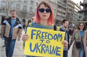  ?? ANDREJ ISAKOVIC/AFP VIA GETTY IMAGES ?? Protesters in Belgrade, Serbia, on Friday mark one year since the invasion of Ukraine by Russia. The White House announced Friday the Pentagon would commit $2 billion for the fight against Russia.