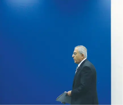  ?? (Reuters) ?? THEN-PALESTINIA­N AUTHORITY Prime Minister Salam Fayyad arriving at a meeting in Ramallah in 2012.