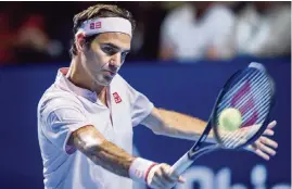 ?? FABRICE COFFRINI AFP/Getty Images ?? Roger Federer defeated Russia's Daniil Medvedev in Saturday’s semifinal of the Swiss Indoors in Basel. Federer will play 93rd-ranked Marius Copil today.