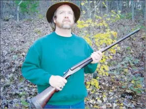  ?? COURTESY OF THERESA SUTTON ?? Keith Sutton takes a moment to be with “Helen,” his Remington Arms double-barrel 12-gauge shotgun.