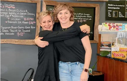  ?? CATHERINE GROENESTEI­N/STUFF ?? Nadine Vandenberg, owner of Arabica Cafe, was thrilled when her friend Donnella Weir, owner of The Burnt Place, came and worked with her to keep the cafe open during a dire staff shortage.