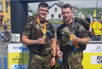  ?? Jason Foley and John Anthony Thomas after finishing their DAR army gear challenge. ??