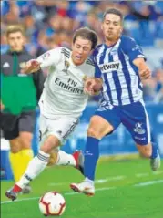  ?? AFP ?? Real Madrid's Alvaro Odriozola (L) vies with Alaves's Ruben Duarte during their La Liga clash in Vitoria on Saturday.