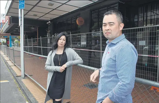  ?? Picture / Mark Mitchell ?? Tania Siladi and Brent Wong outside the cordon that is keeping them from returning to their Wellington restaurant.