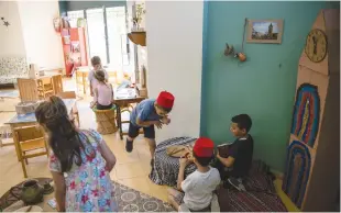  ?? (Ronen Zvulun/Reuters) ?? CHILDREN PLAY in a classroom at Hand in Hand, a mixed Jewish-Arab kindergart­en, in Jaffa.