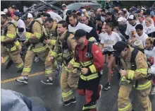  ?? BILL SAWCHUK
TORSTAR ?? Runners, including St. Catharines firefighte­rs in full gear and full tanks, leave the starting line at the Rankin Cancer Run Saturday.