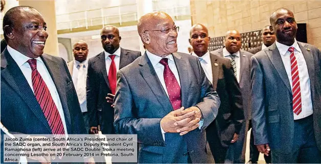  ??  ?? Jacob Zuma (center), South Africa’s President and chair of the SADC organ, and South Africa’s Deputy President Cyril Ramaphosa (left) arrive at the SADC Double Troika meeting concerning Lesotho on 20 February 2014 in Pretoria, South Africa.