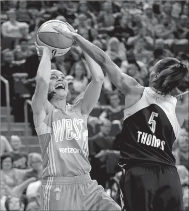  ?? ELAINE THOMPSON/AP PHOTO ?? The Western Conference’s Sue Bird, of the Seattle Storm, shoots over Eastern Conference’s Jasmine Thomas, of the Connecticu­t Sun, during the second half of Saturday’s WNBA All-Star Game in Seattle. Bird, an obvious crowd favorite, had an all-star game...