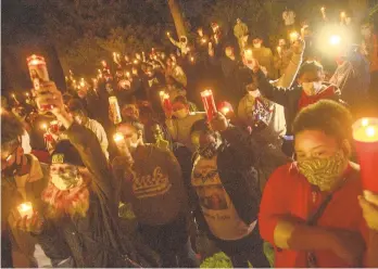  ?? PHOTOS BYAPRILGAM­IZ/THE MORNING CALL ?? People gather for a candleligh­t vigil for slain Whitehall student Aiden Toussaint, who was shot dead on Sept. 29 near Saucon Park. The vigil was held in Whitehall on Thursday.