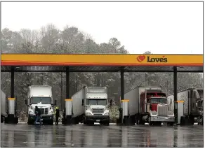  ?? (AP) ?? Trucks parks at the pumps of a gas station in Emerson, Ga., north of Atlanta, in this file photo. A pilot program to allow people as young as 18 to drive long-haul trucks across the country is being proposed by the Federal Motor Carrier Safety Administra­tion.