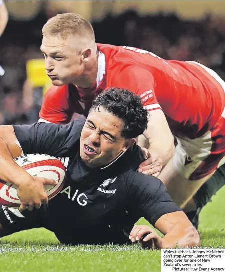  ?? ?? Wales full-back Johnny McNicholl can’t stop Anton Lienert-Brown going over for one of New Zealand’s seven tries
Pictures: Huw Evans Agency