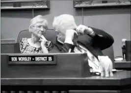  ?? ASSOCIATED PRESS ?? RETIRING STATE SEN. JUDY BURGES LISTENS TO A TRIBUTE and Sen. Bob Worsley rubs his eyes as the Arizona Legislatur­e prepares to wrap up its 2018 session in Phoenix on Thursday. The Arizona Legislatur­e has adjourned it 2018 session, leaving several...