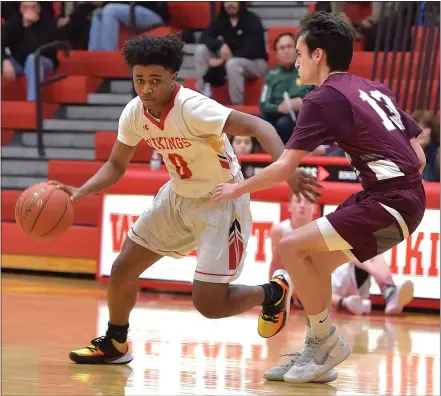  ?? PETE BANNAN — MEDIANEWS GROUP ?? West Chester East’s Destined McCray drives against West Chester Henderson in the third quarter Tuesday night. The VIkings went on to a 59-43 victory.