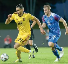  ?? AFP ?? Belgium midfielder Nacer Chadli ( left) and Runar Mar Sigurjonss­on of Iceland vie for the ball during their Nations League match in Reykjavik, Iceland on Tuesday. —